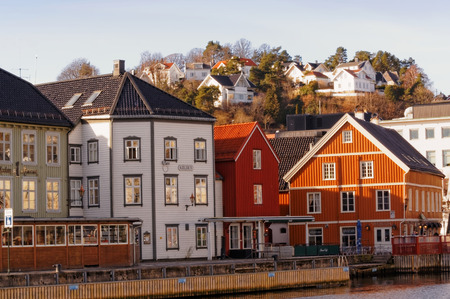 Arendal, Aust-Agder. Norway - February 2015. Famous Bryggen street with wooden colored houses in...