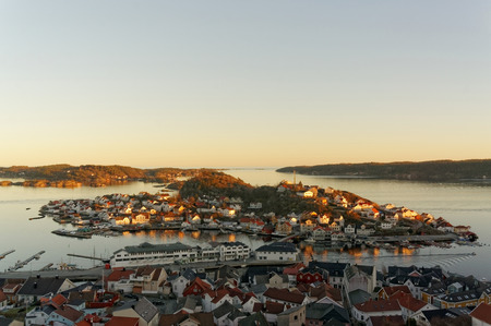 Kragero, Telemark. Norway - February 2015. Sunset over the fjord. On the shore of the island of...