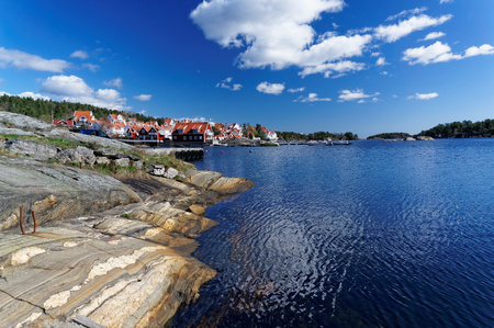 Telemark, Norway - April 27, 2015. Norwegian fjord spring, colorful houses on the edge of summer....