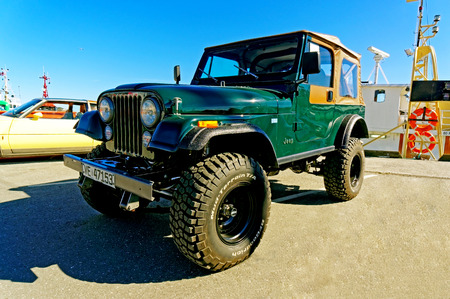 Kragero, Norway, 4 April 2015: Jeep  in green at Exhibition of old cars small town on the coast of...