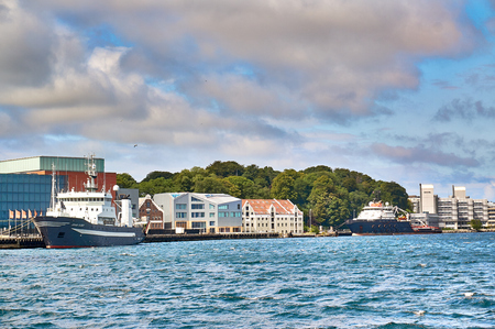 Stavanger, Norway - July 26, 2015:  Traditional wooden houses architecture. Fjord - Boknafjord, county Rogaland region Vestlandet.のeditorial素材