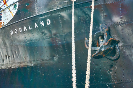 Stavanger, Norway - July 26, 2015: And riveted metal from the ship's side pulled anchor. Fjord - Boknafjord, county Rogaland region Vestlandet.のeditorial素材