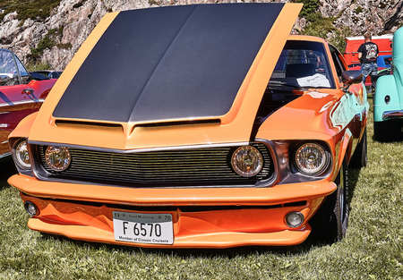 Froya island, Norway - 24 July 2016: Side of the classic Frod Mustang from 1970 car in black and...