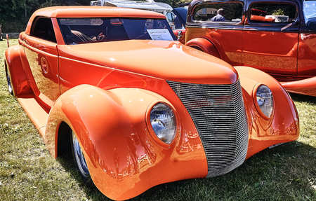 Froya island, Norway - 24 July 2016: Side of the classic car in orange cars at the show in norwegian Islanders Classic Car Club - Kysttreffet 2016.Island in the Atlantic Ocean and Norwegian fjord.のeditorial素材