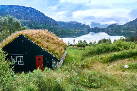 Larvik, Norway - July 27, 2015: Traditional cottage with a green roof. Around Stavanger, Rogaland county, Norway.のeditorial素材