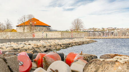 Kristiansand, Norway - June 4, 2015: Colorful sea buoys, red and orange plastic buoys. Gulf of Kristiansand. Sunny day in summer in Norwayのeditorial素材