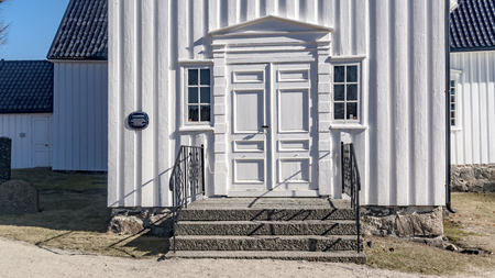 Drangedal, Norway - April 8, 2015: Telemark fylke, Drangedal kommune. Drangedal kirke located in Drangedal parish in Bamble rural deanery. The building material is wood and was built in 1775.のeditorial素材