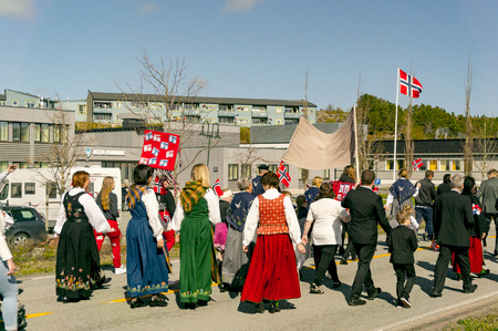 Filan Hitra, Norway - May 17, 2017: Celebration of Norway's Constitution Day. People in the Norwegian national costumes with embroidery, silver jewelry. Traditional celebration street parade.のeditorial素材