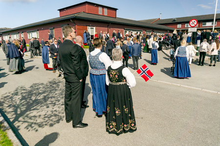 Filan Hitra, Norway - May 17, 2017: Celebration of Norway's Constitution Day. People in the Norwegian national costumes with embroidery, silver jewelry. Traditional celebration street parade.のeditorial素材