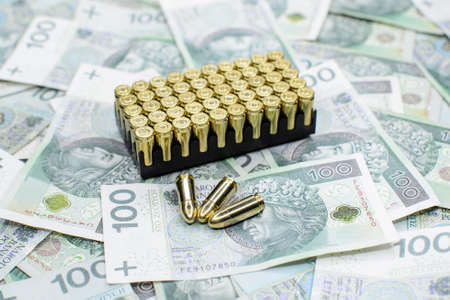 Bulk of pistol ammunition on money