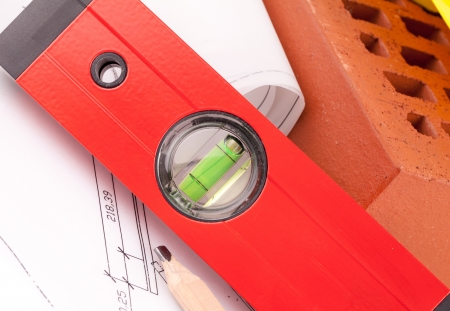 brick, tools and construction plans