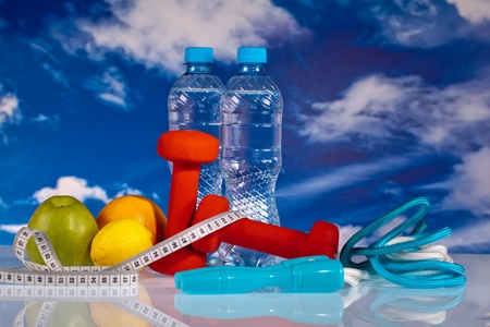 fitness dumbbellswater , jump rope and fruitsの写真素材