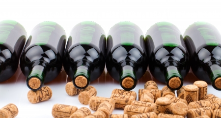 wine bottles and corks  on white backgroundの写真素材