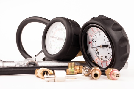 pressure gauges and tools isolated on whiteの写真素材