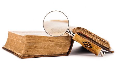 old book and magnifying glass の写真素材