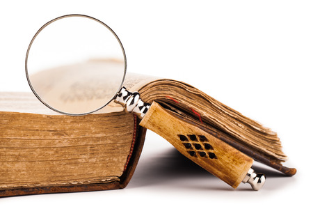 old book and magnifying glass の写真素材
