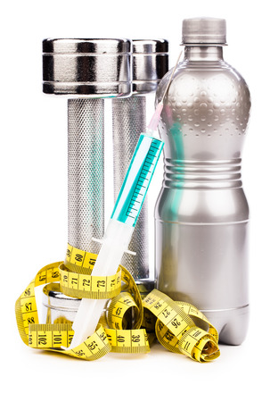fitness dumbbells and  syringe  isolated on whiteの写真素材