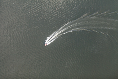 aerial view of motorboat on lakeの写真素材