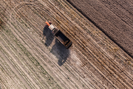 aerial view of harvest fields with tractor in Poland