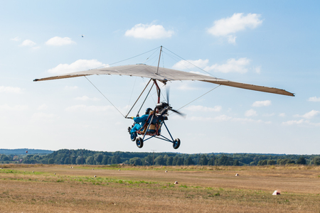 The motorized hang glider in the blue skyの写真素材
