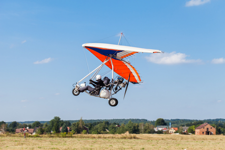 The motorized hang glider in the blue skyの写真素材