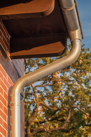 gutter pipe and brick wall