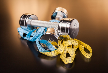 fitness equipment andmeasure tape on black surfaceの写真素材