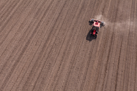 aerial view of  tractor on harvest field in Poland