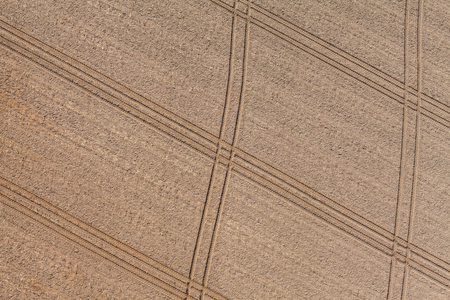 aerial view of the tractor tracks on the harvest field  in Polandの写真素材