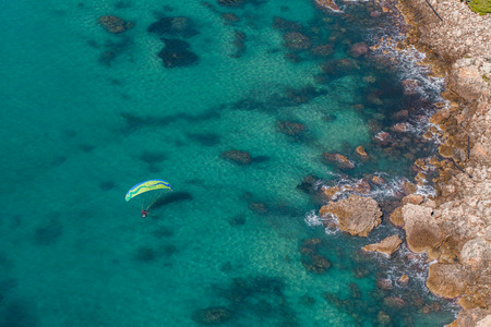 aerial view of the paraglider over the coast line in Greeceの写真素材