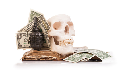 human scull  and holy book isolated on white backgroundの写真素材