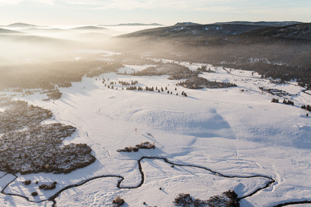 aerial view of the forest in winter time in Poland in Karkonosze mountainsの写真素材