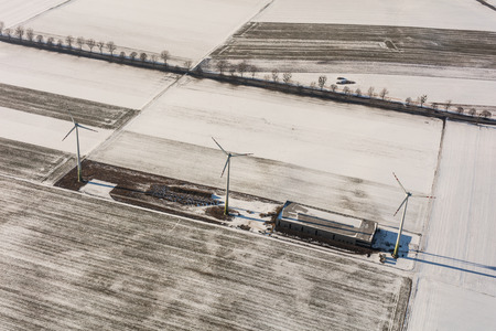 aerial view of wind turbine on a winter field in Poland