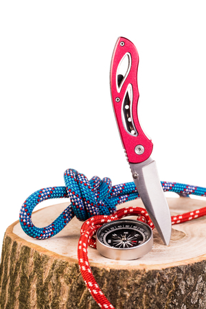 wooden  log and knife isolated on whiteの写真素材