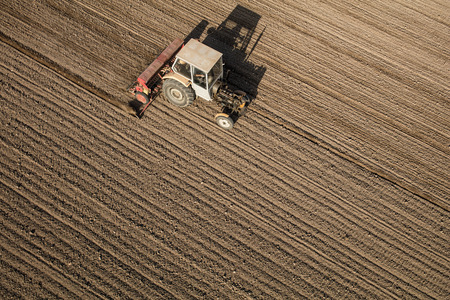aerial view of the tractor on the harvest field in Poland