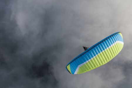aerial view of the paraglider over the cloudsの写真素材