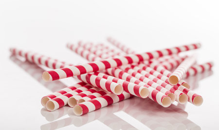 drinking paper straw isolated on whiteの写真素材