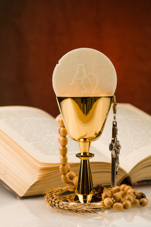 holy communion chalice on white tableの写真素材