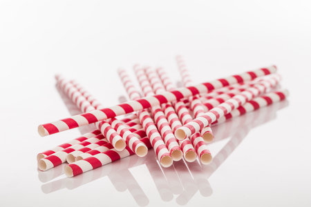 drinking paper straw isolated on whiteの写真素材