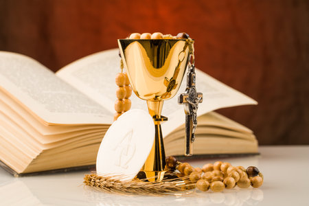 holy communion chalice on white tableの写真素材