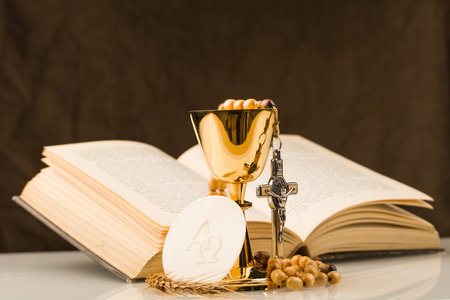 holy communion chalice on white tableの写真素材