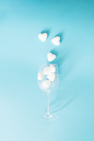 hearts going out of wine glass.minimal concept on a blue backgroundの写真素材