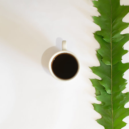 cup of coffee on a white background with green leaves.nature relax concept idea.autumn design