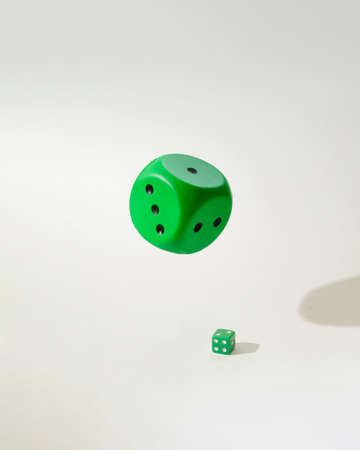 green dice big and small one.white background with shadows.idea concept designの写真素材