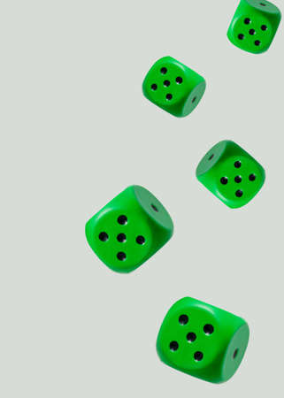 flying object green dice.white background.uncertainty and hazard idea concept designの写真素材