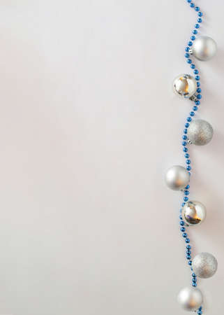 Christmas background with metallic silver shiny beautiful sparkly baubles.Celebration concept flat lay designの写真素材