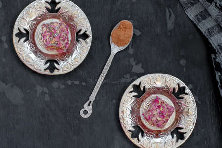 Oriental sweets Turkish delight and carved cupの写真素材