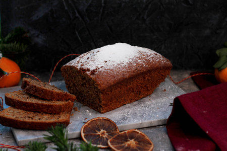 Quiche pie with chicken and sun-dried tomatoes on a light background, spices are scattered nearbyの写真素材