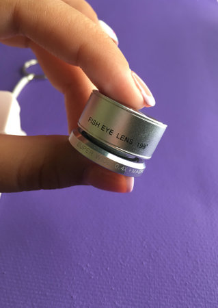 green instant camera instax lies on a green backgroundのeditorial素材