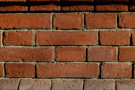 texture of an old red rough brick in an old building, close-up
